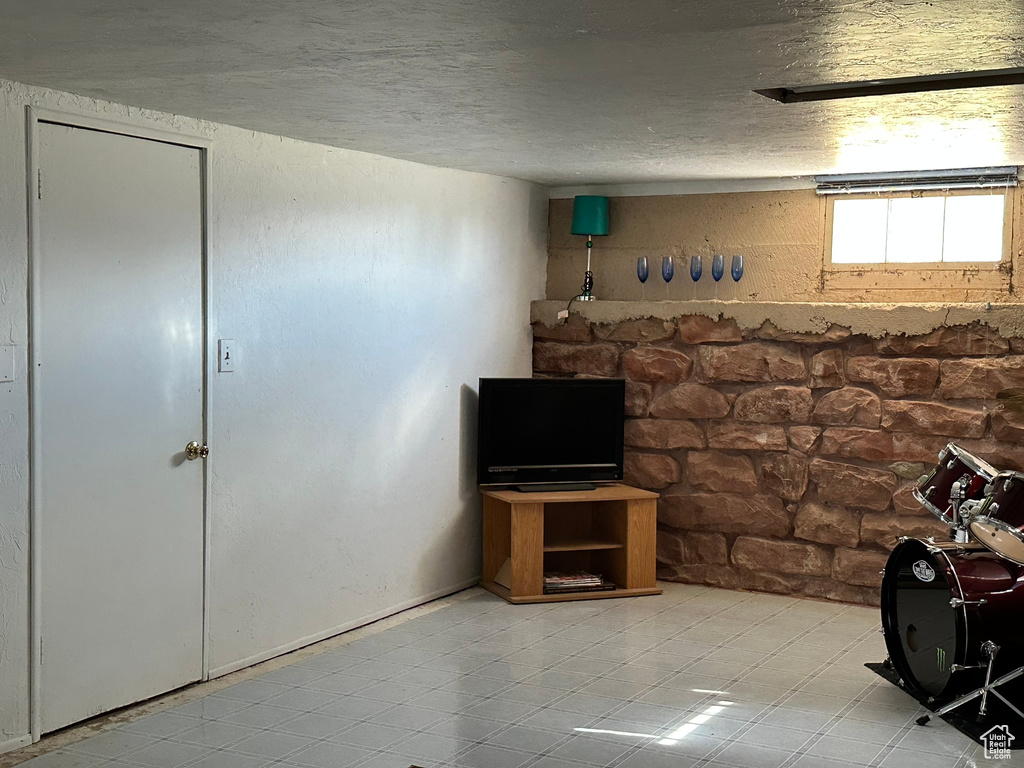 Unfurnished living room with a textured ceiling