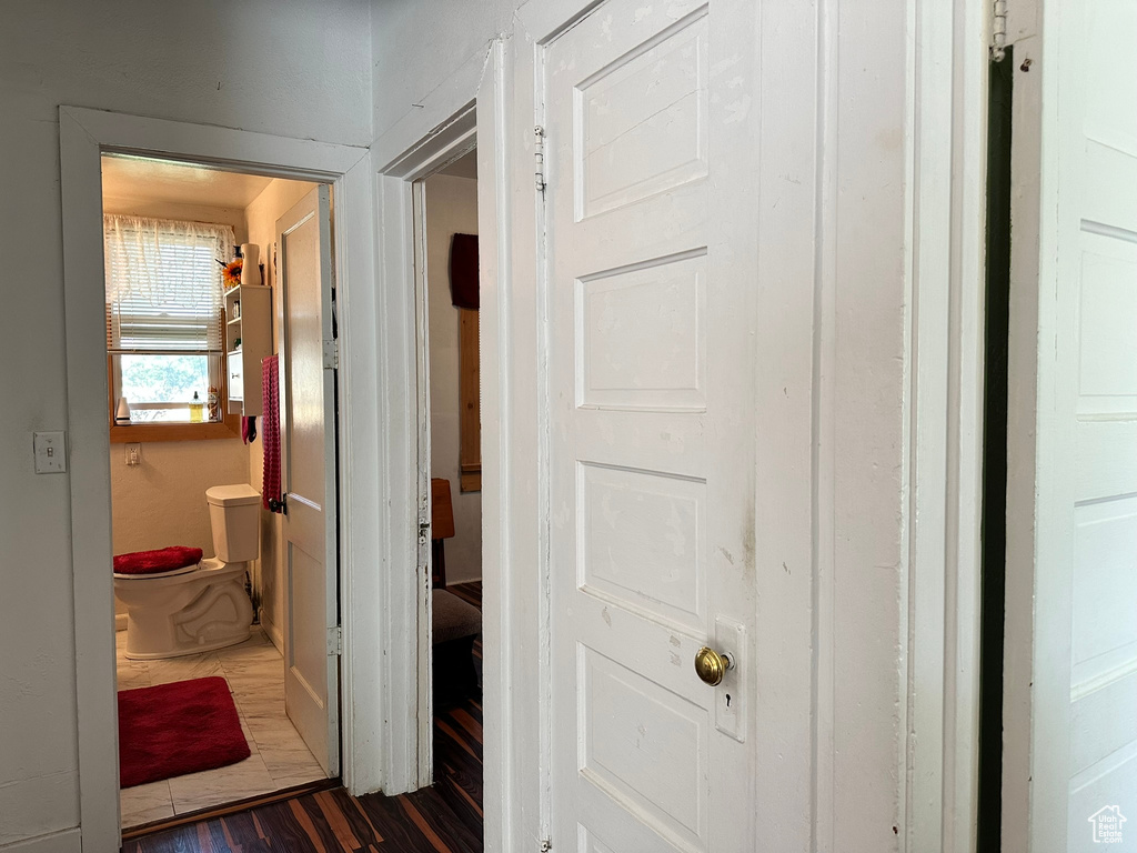 Hall with dark wood-type flooring