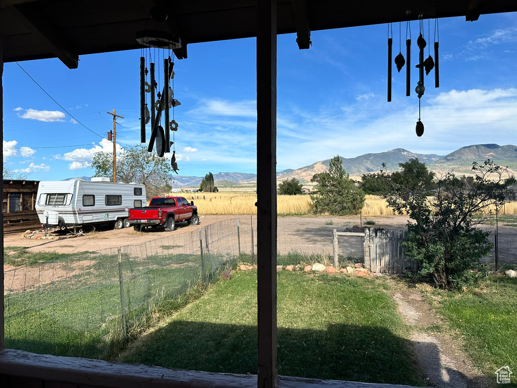View of yard with a mountain view and a view of countryside