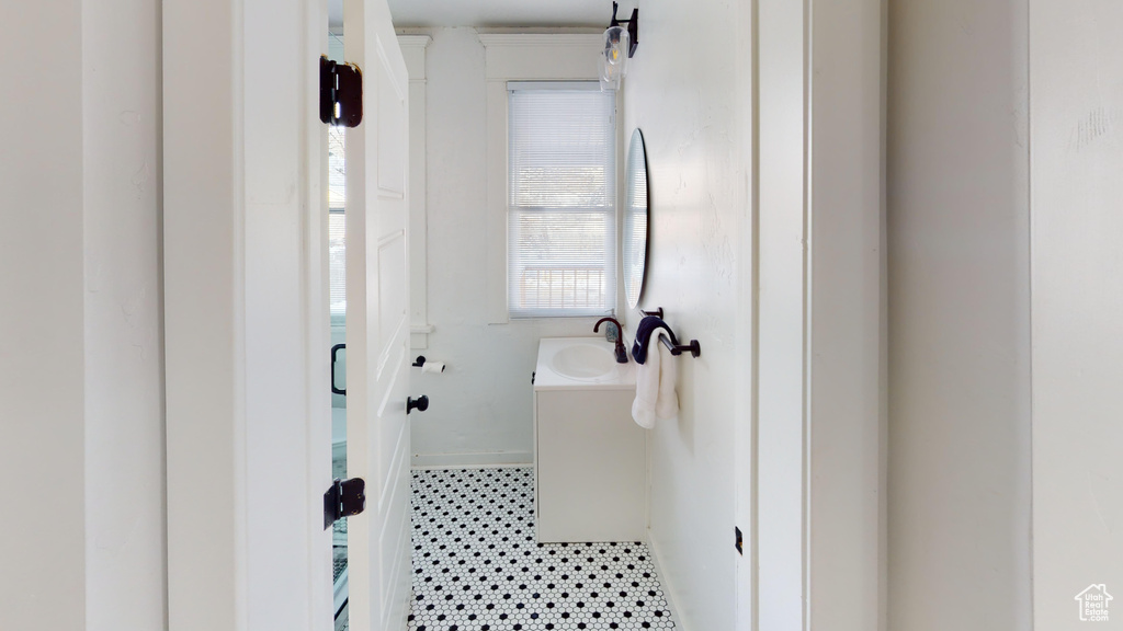 Bathroom with a sink and tile patterned floors