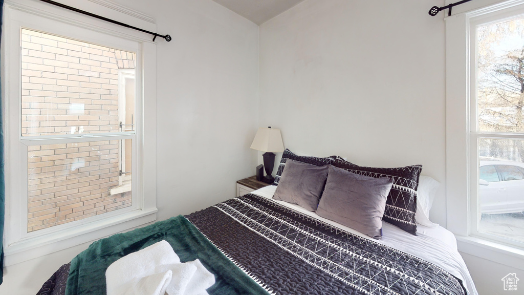 Bedroom with multiple windows