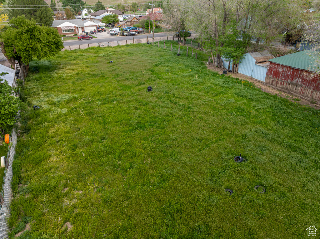 View of yard featuring fence