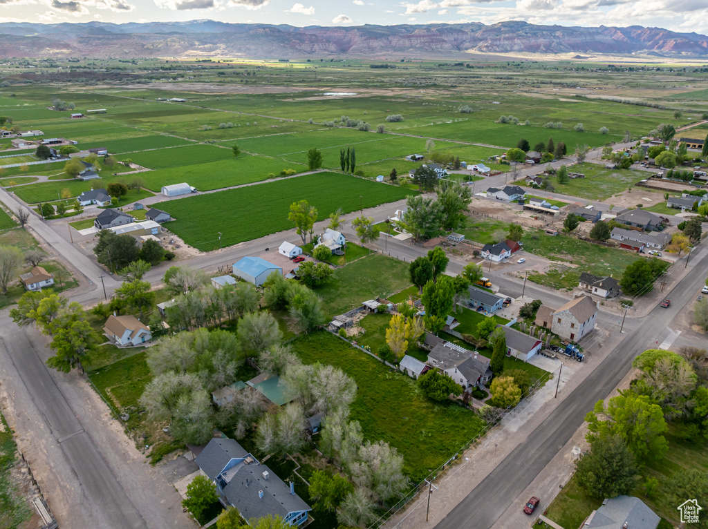 Aerial view of property's location with a mountainous background and rural landscape