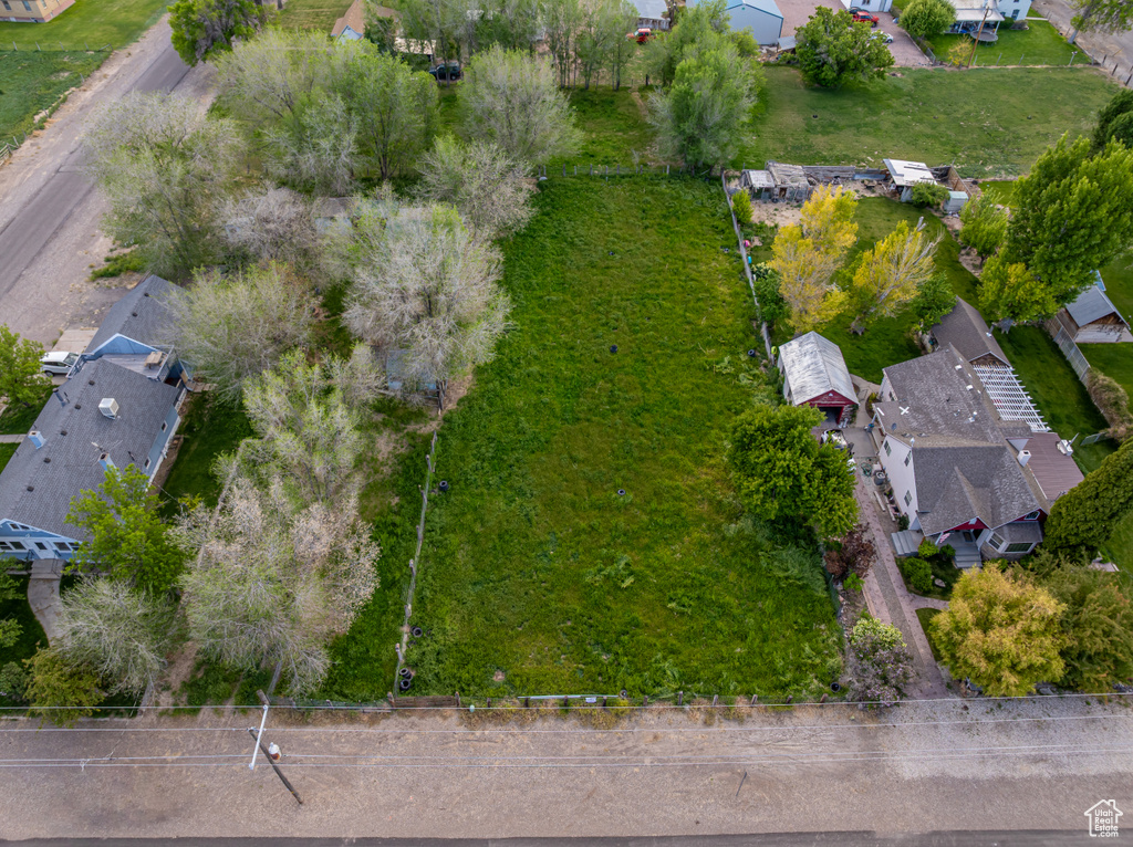 Aerial view of property and surrounding area with nearby suburban area