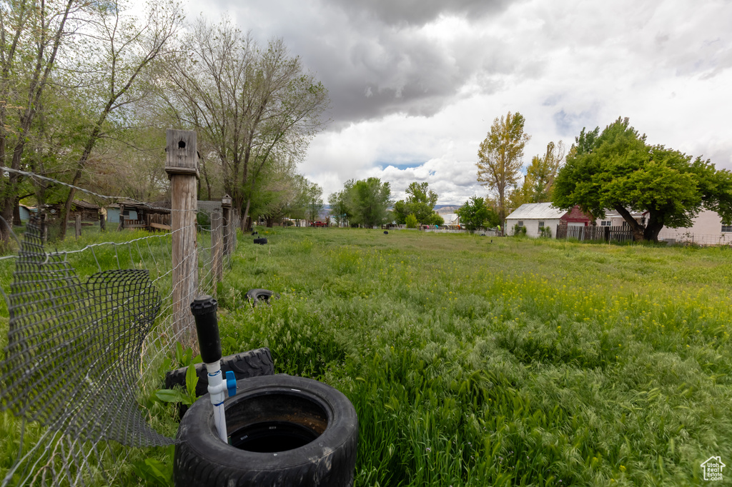 View of yard featuring fence