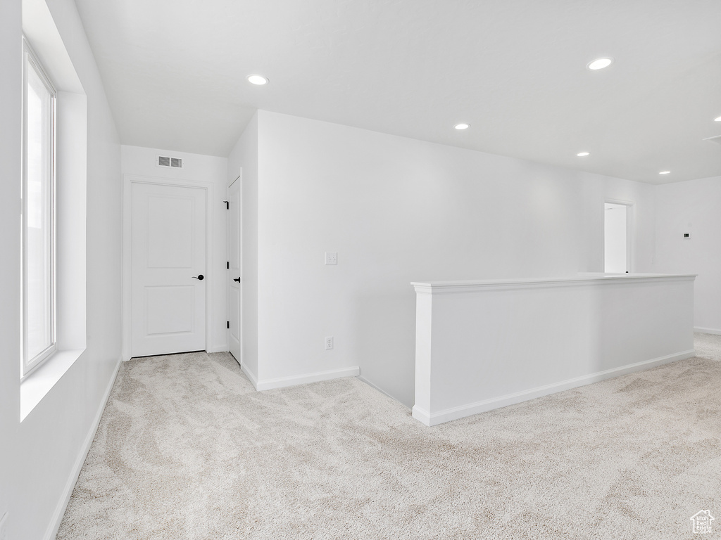 Unfurnished room featuring carpet floors, recessed lighting, and baseboards