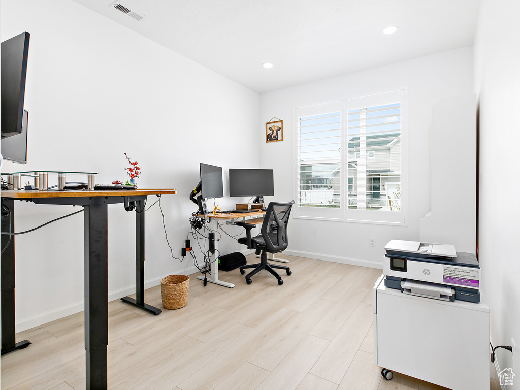 Home office with light wood finished floors, baseboards, and recessed lighting