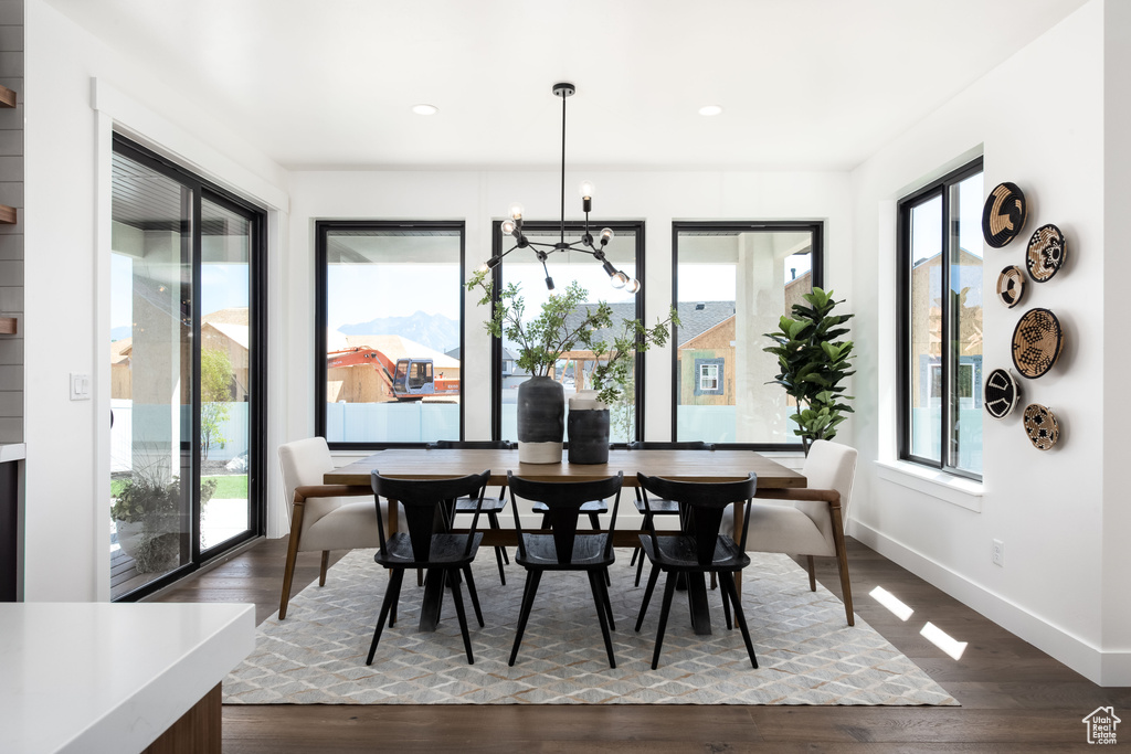 Dining space with baseboards, recessed lighting, and dark wood finished floors