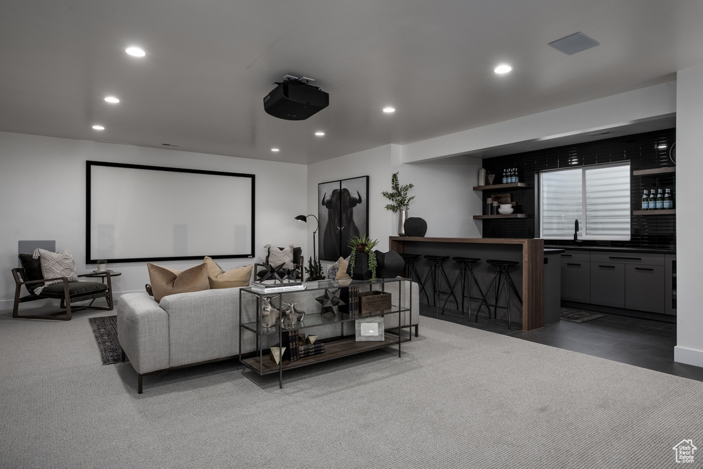 Cinema with wet bar and recessed lighting