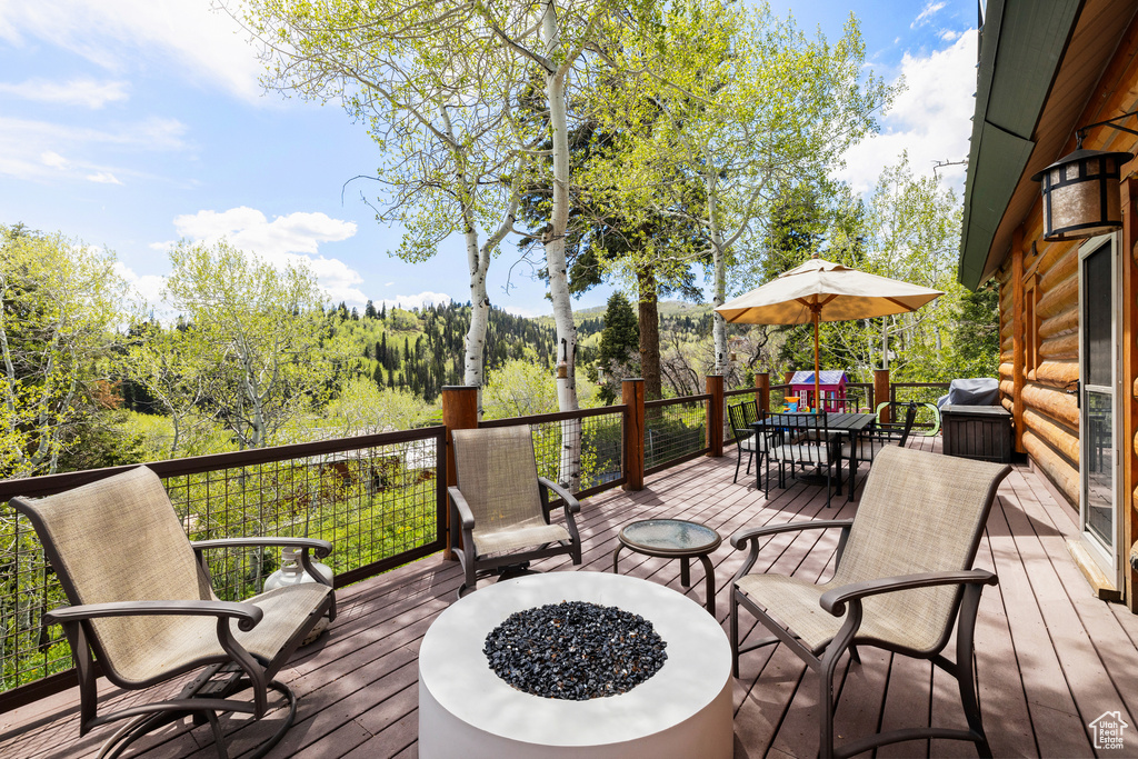 Wooden terrace with outdoor dining space