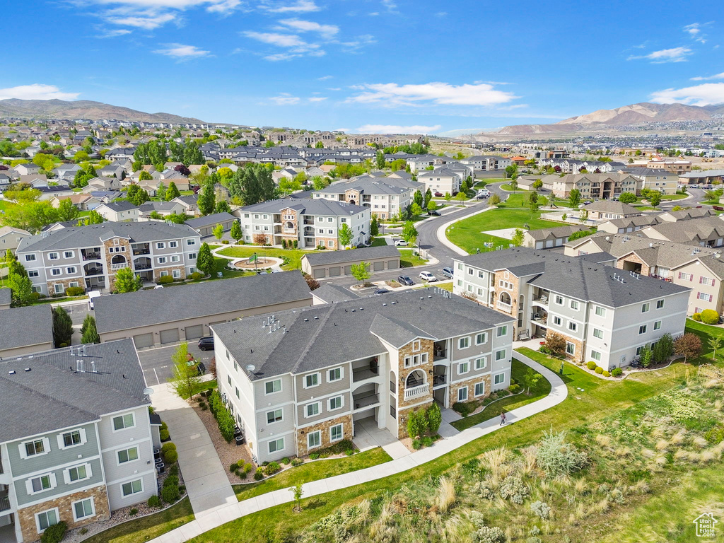 Aerial view of residential area featuring a mountain backdrop