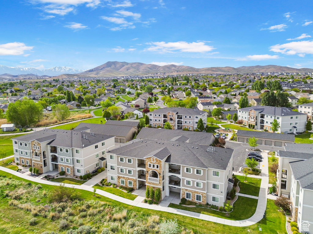 Aerial perspective of suburban area with a mountainous background