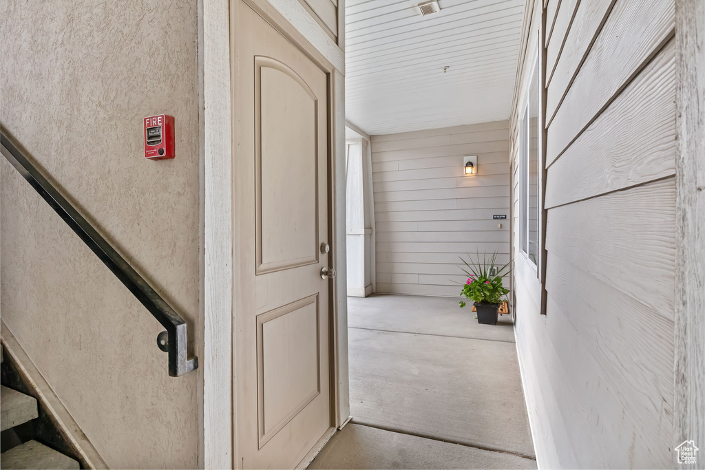 Property entrance featuring stucco siding