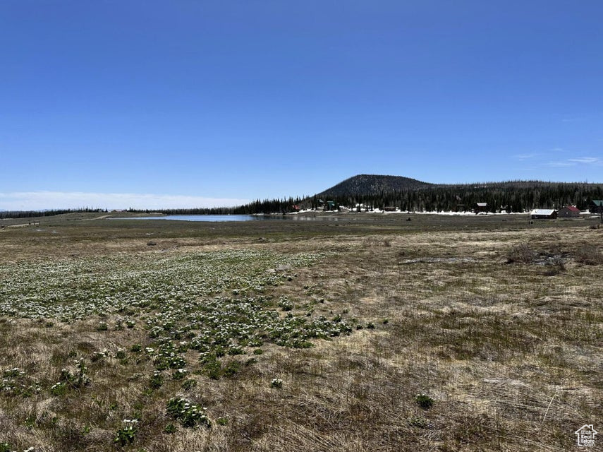 Mountain view featuring a nearby body of water