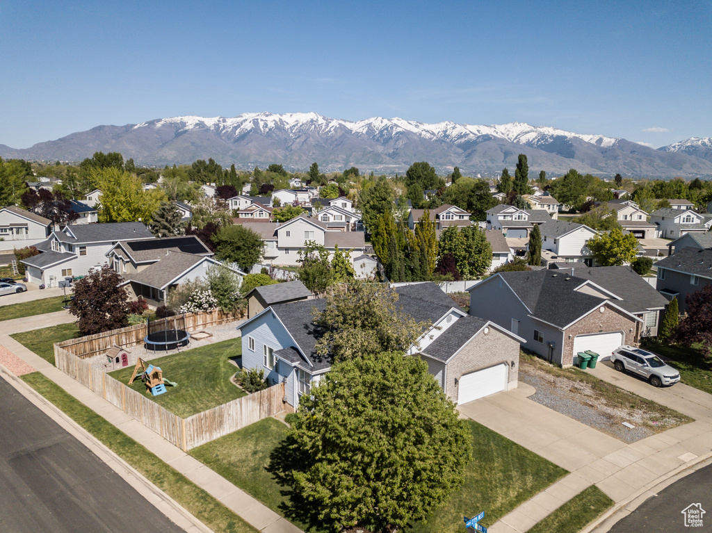 Drone / aerial view featuring a mountain view and a residential view
