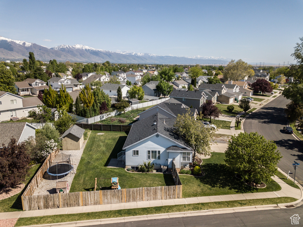 Drone / aerial view featuring a mountain view and a residential view