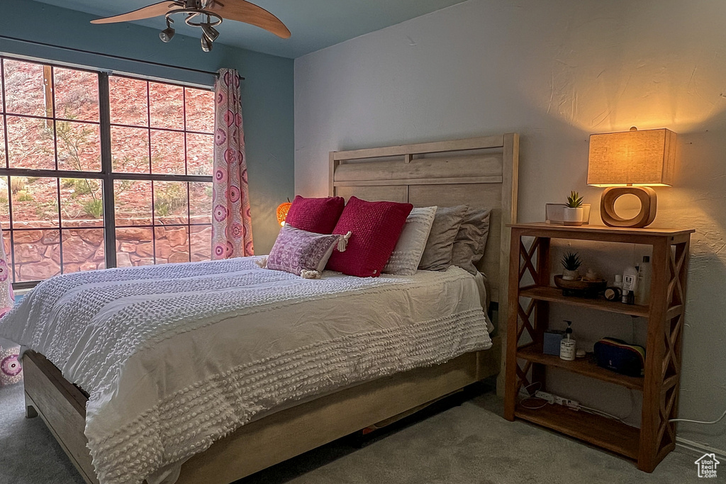 Bedroom with carpet and a ceiling fan