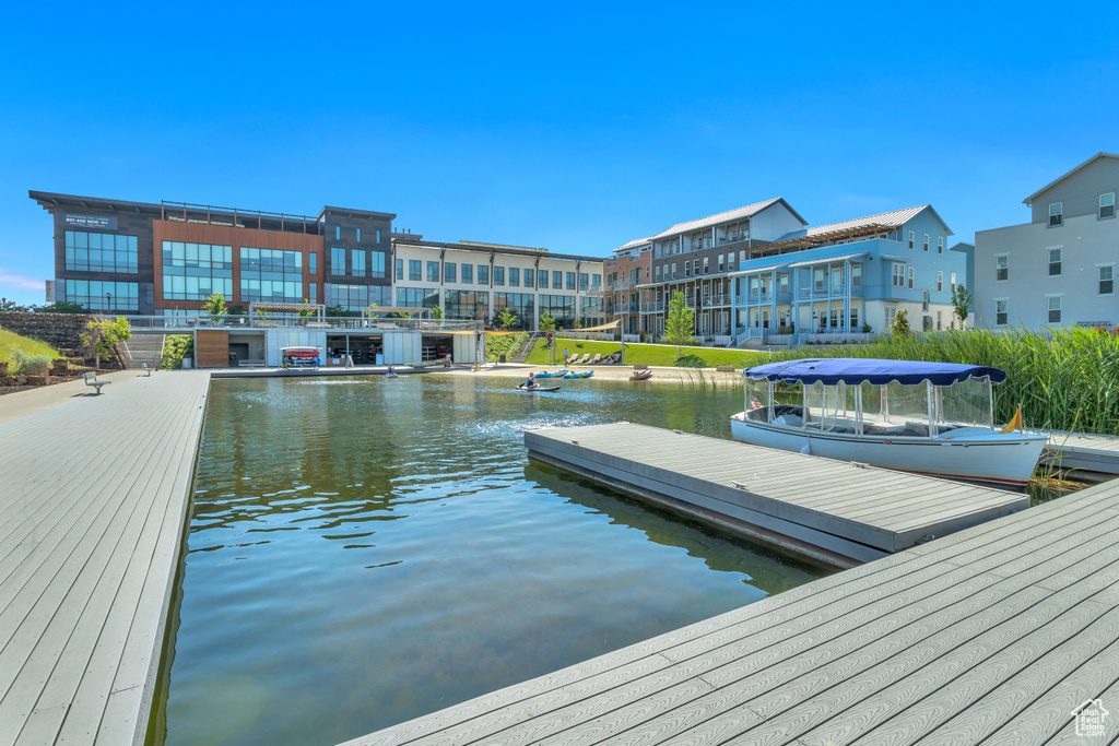 Dock area featuring a water view
