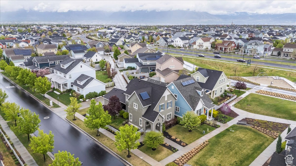 Aerial view featuring a residential view and a water view