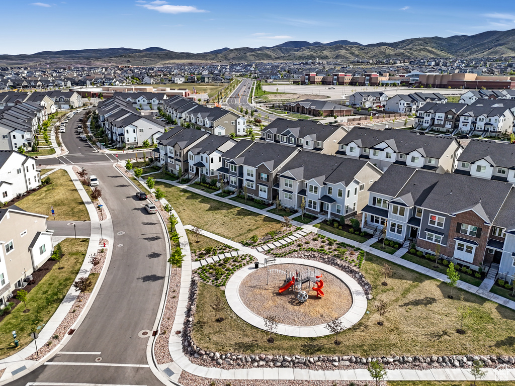 Birds eye view of property with a mountain view and a residential view