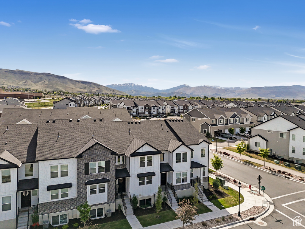 Property view of mountains with a residential view