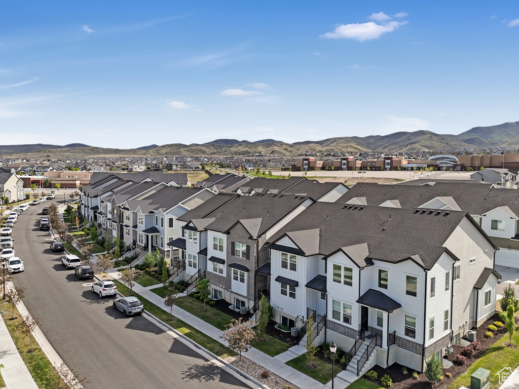 Birds eye view of property featuring a mountain view and a residential view
