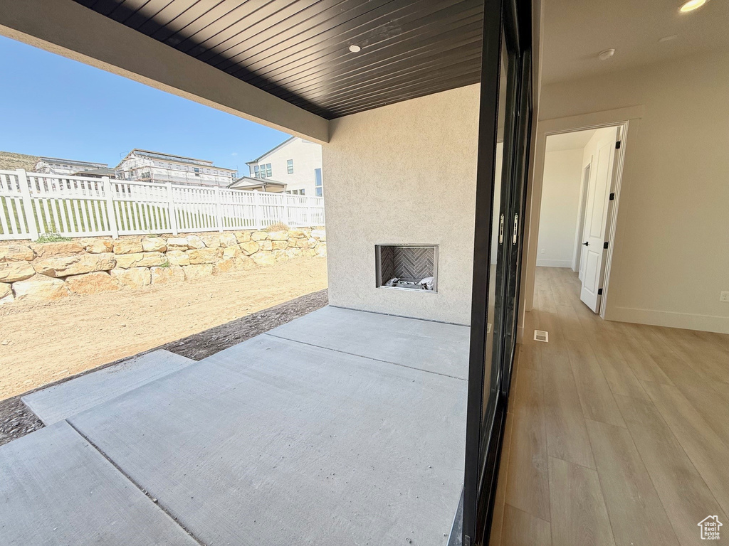 View of patio with fence
