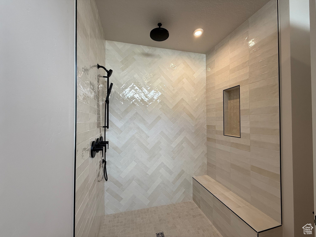 Full bathroom featuring tiled shower
