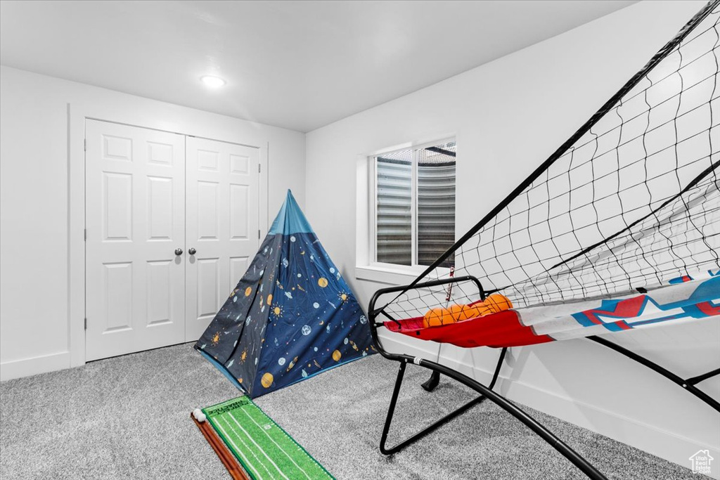 Playroom with carpet flooring and baseboards