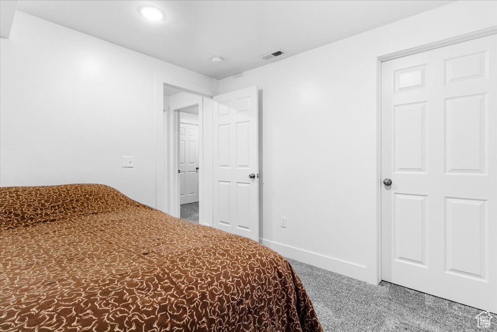 Carpeted bedroom featuring baseboards and recessed lighting