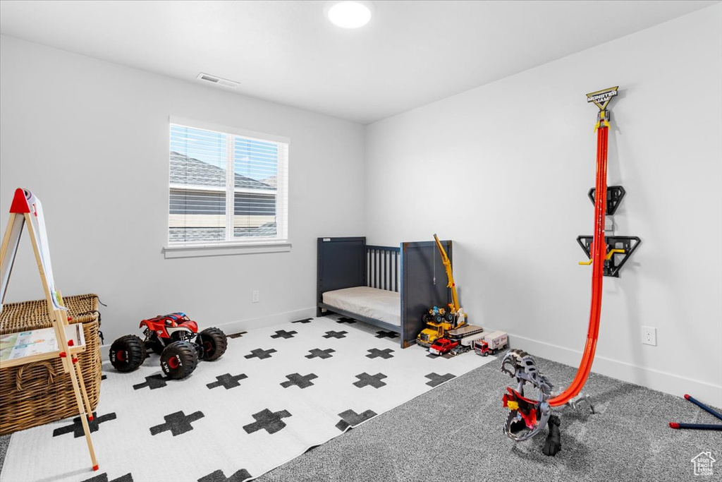 Playroom featuring baseboards and carpet flooring