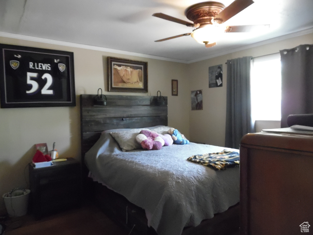 Bedroom featuring crown molding and ceiling fan