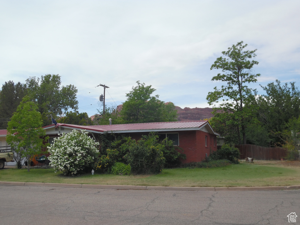 View of side of property with metal roof