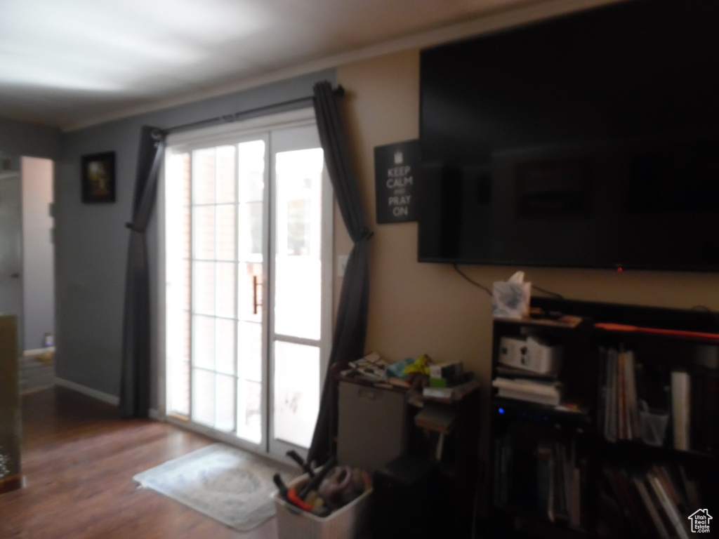 Entryway with wood finished floors and baseboards