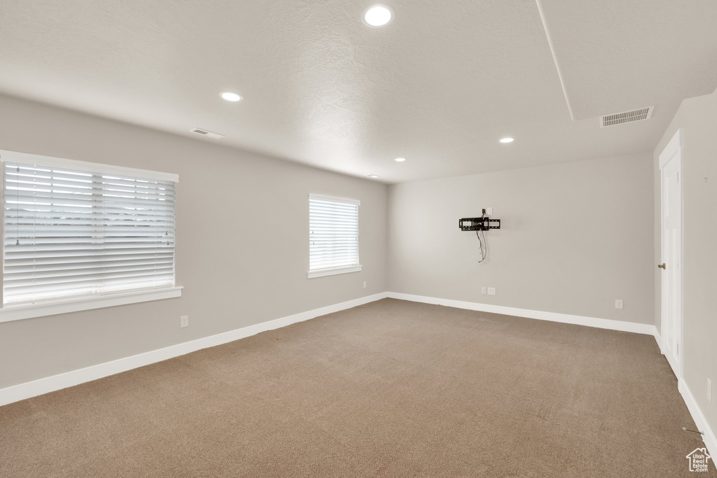 Unfurnished room featuring recessed lighting, carpet flooring, and baseboards