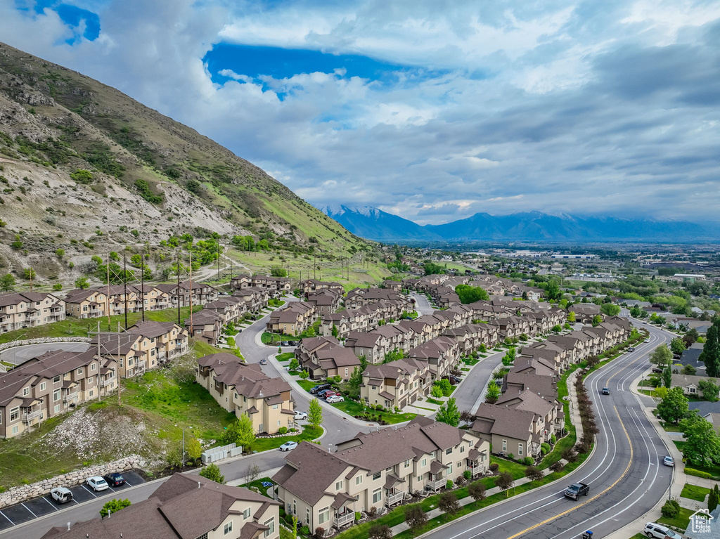 Aerial view of residential area featuring a mountainous background