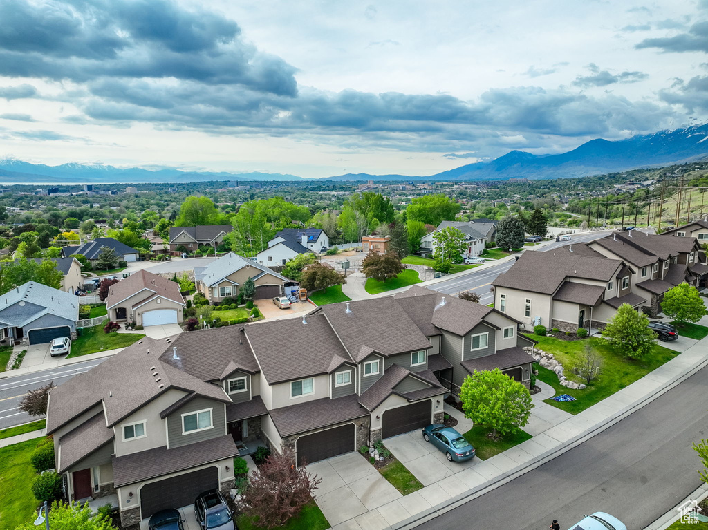 Aerial perspective of suburban area with a mountain backdrop