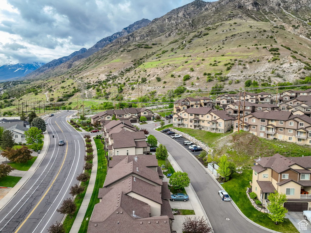 Aerial view of residential area featuring a mountain backdrop