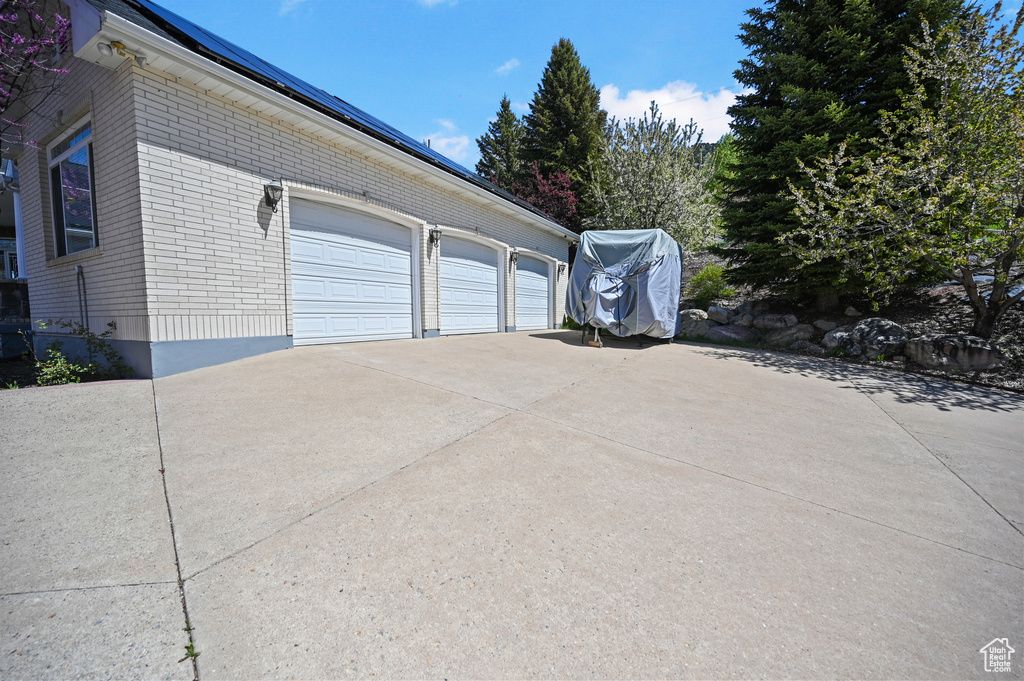 Garage featuring driveway