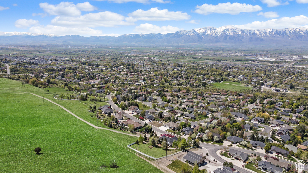 Birds eye view of property featuring a mountain view and a residential view