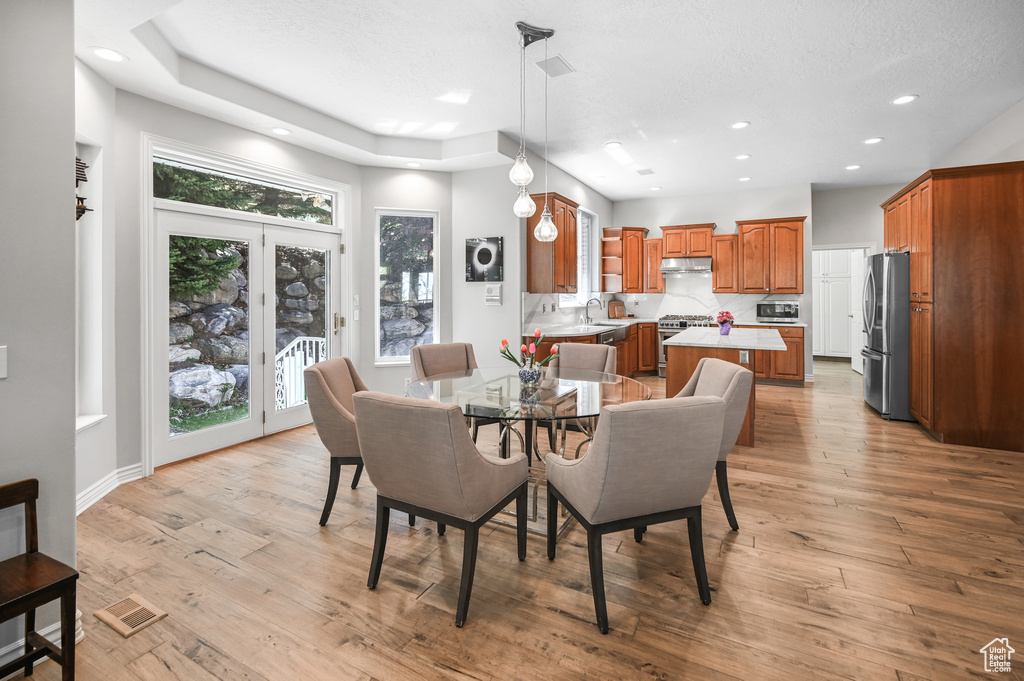 Dining space with recessed lighting, light wood finished floors, and visible vents