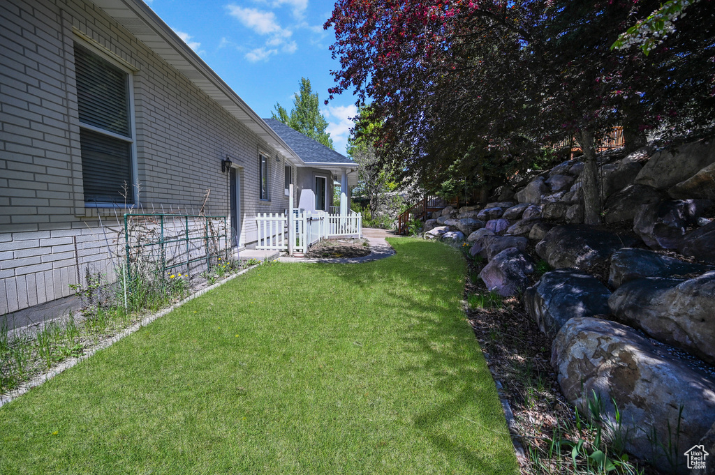 View of yard with fence