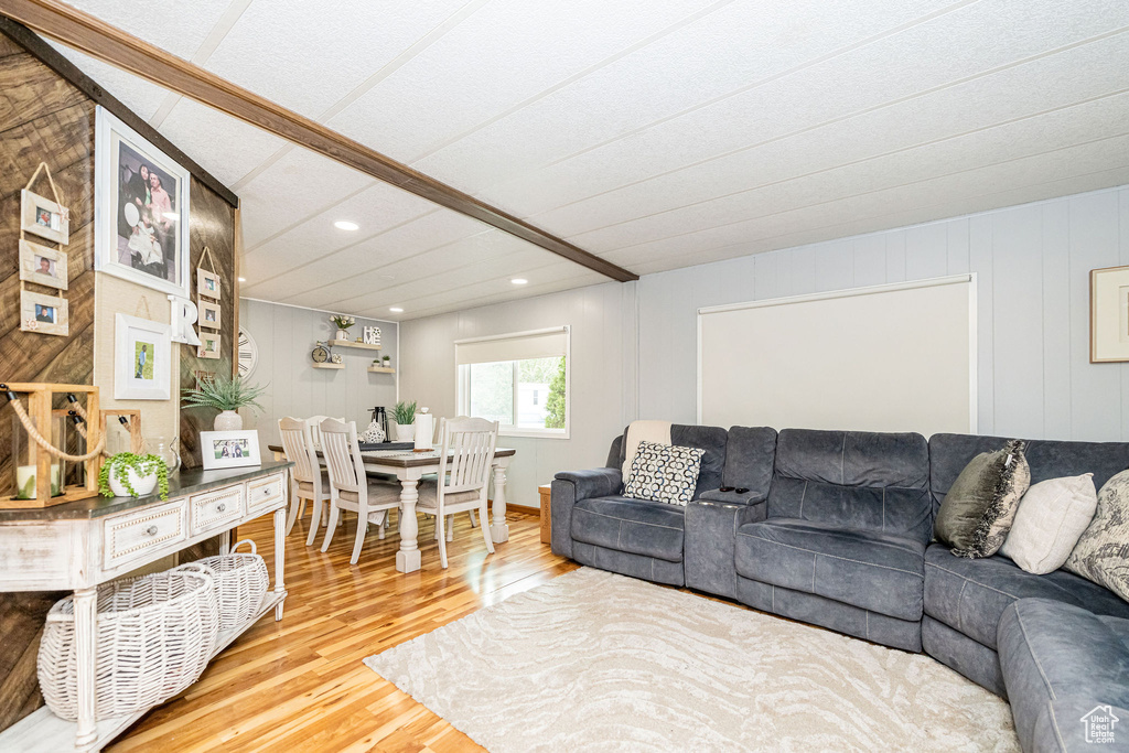 Living room with wood finished floors and recessed lighting
