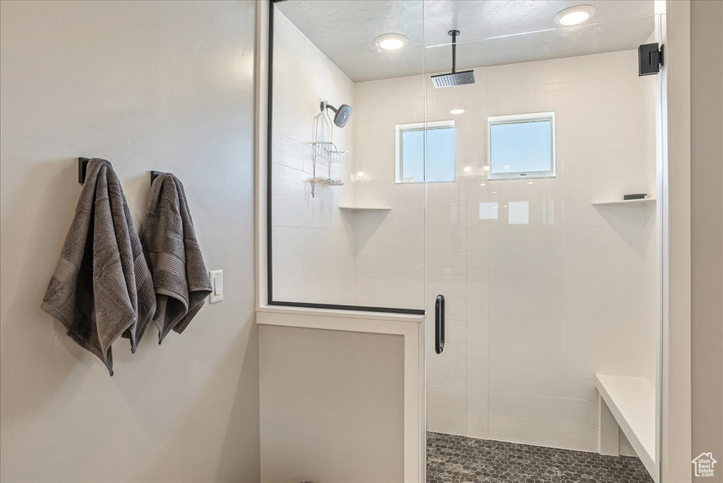 Full bath featuring a shower stall