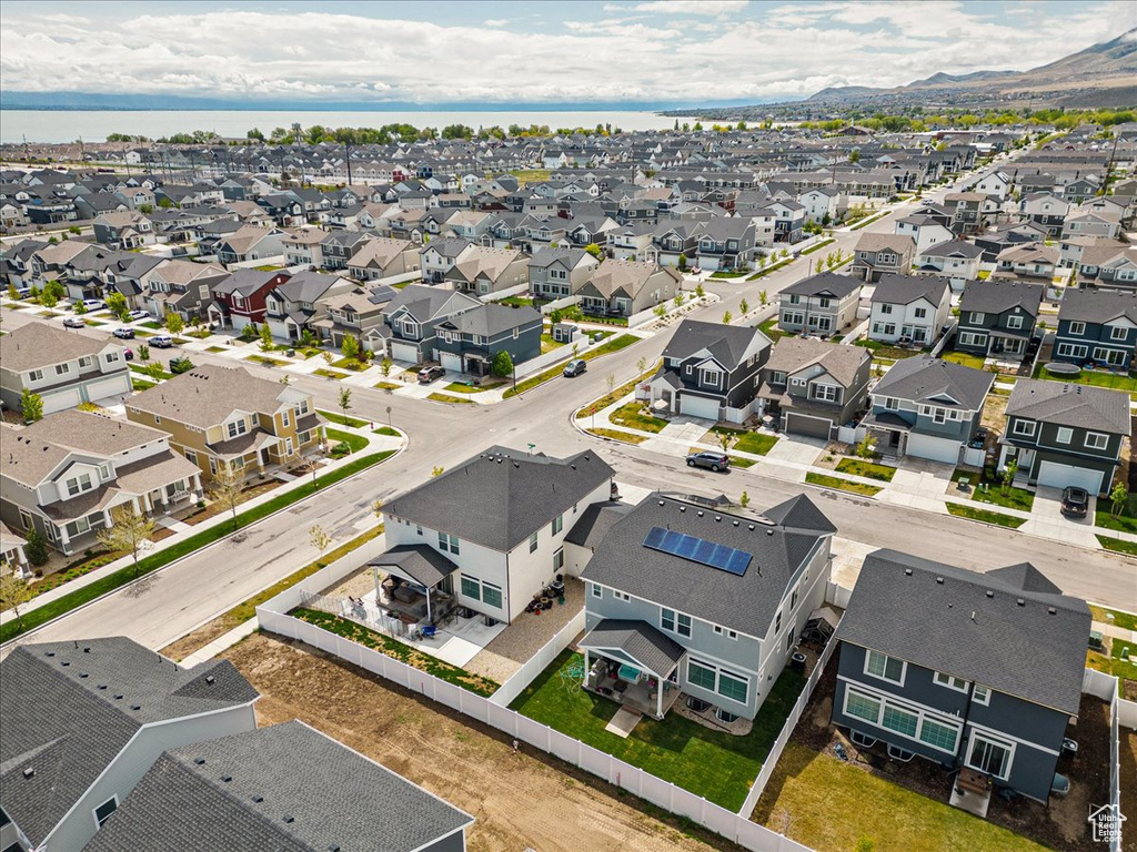 Aerial perspective of suburban area with a mountain backdrop
