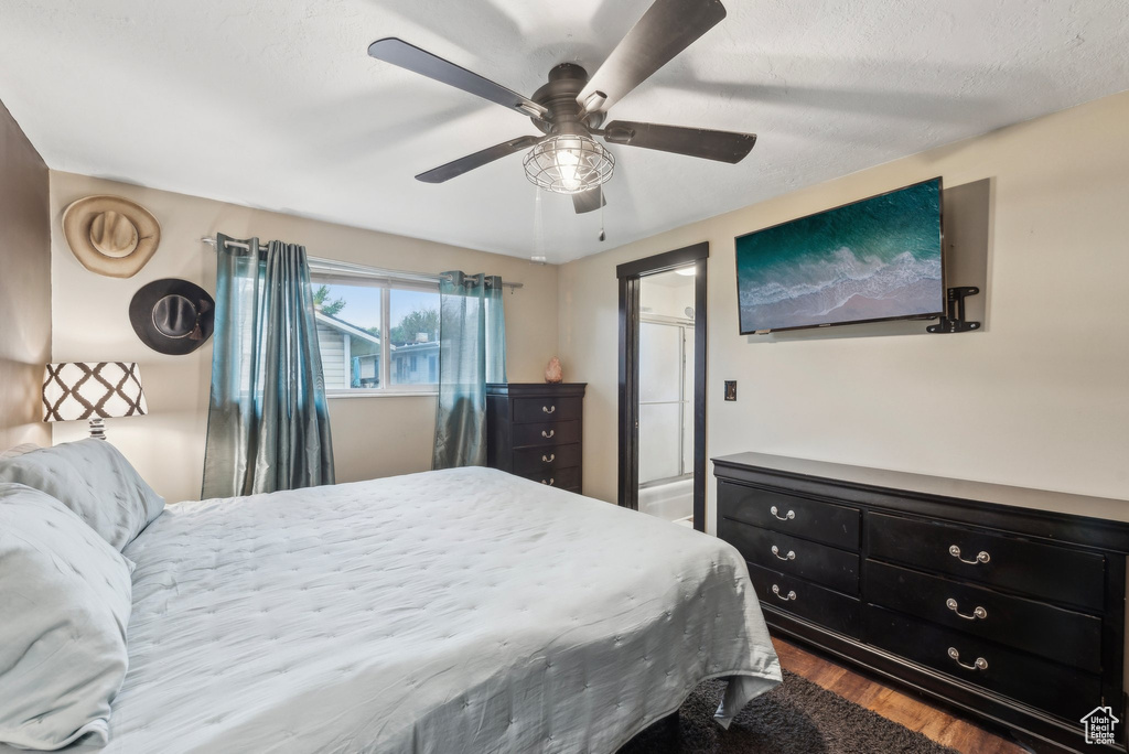 Bedroom featuring dark wood-style flooring and a ceiling fan