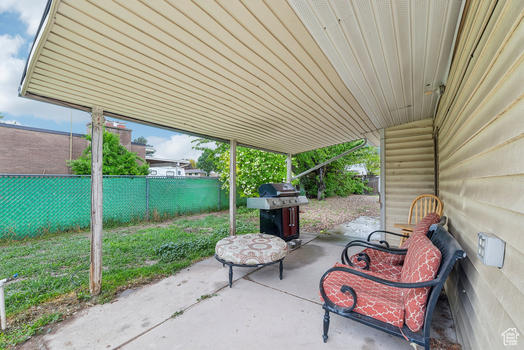 View of patio / terrace with a fenced backyard and area for grilling