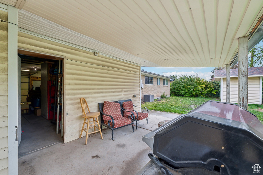View of patio with central AC unit