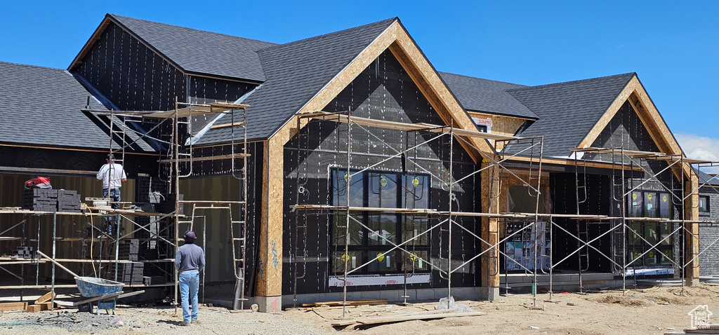 View of home's exterior with a shingled roof