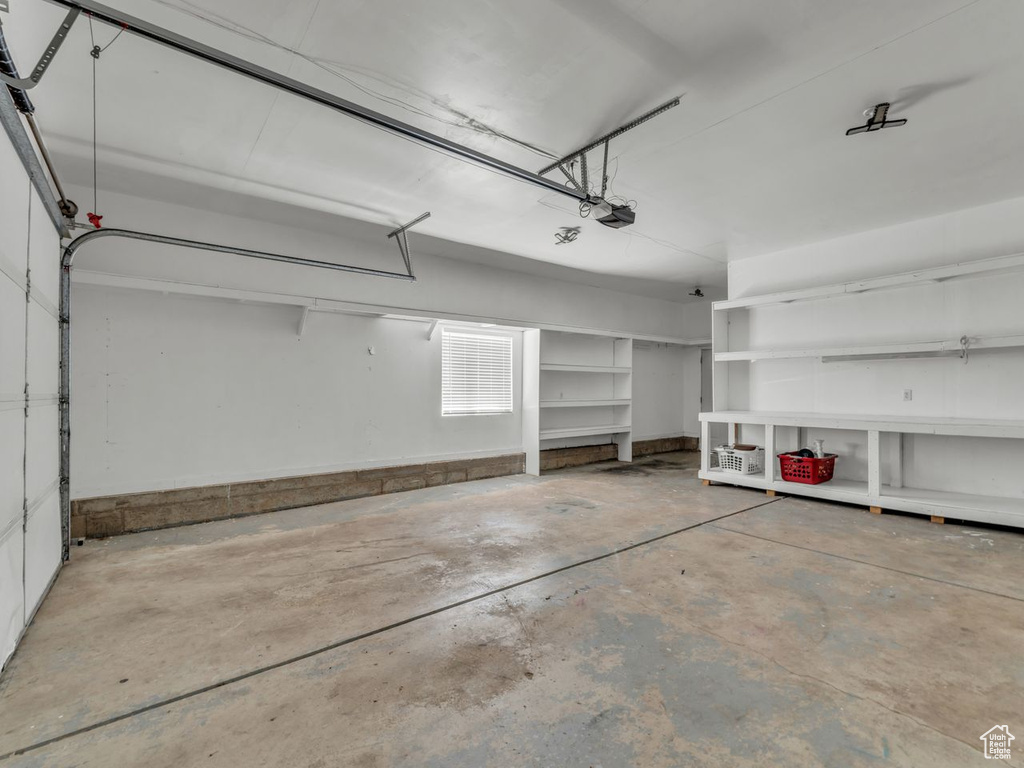 Garage featuring a garage door opener
